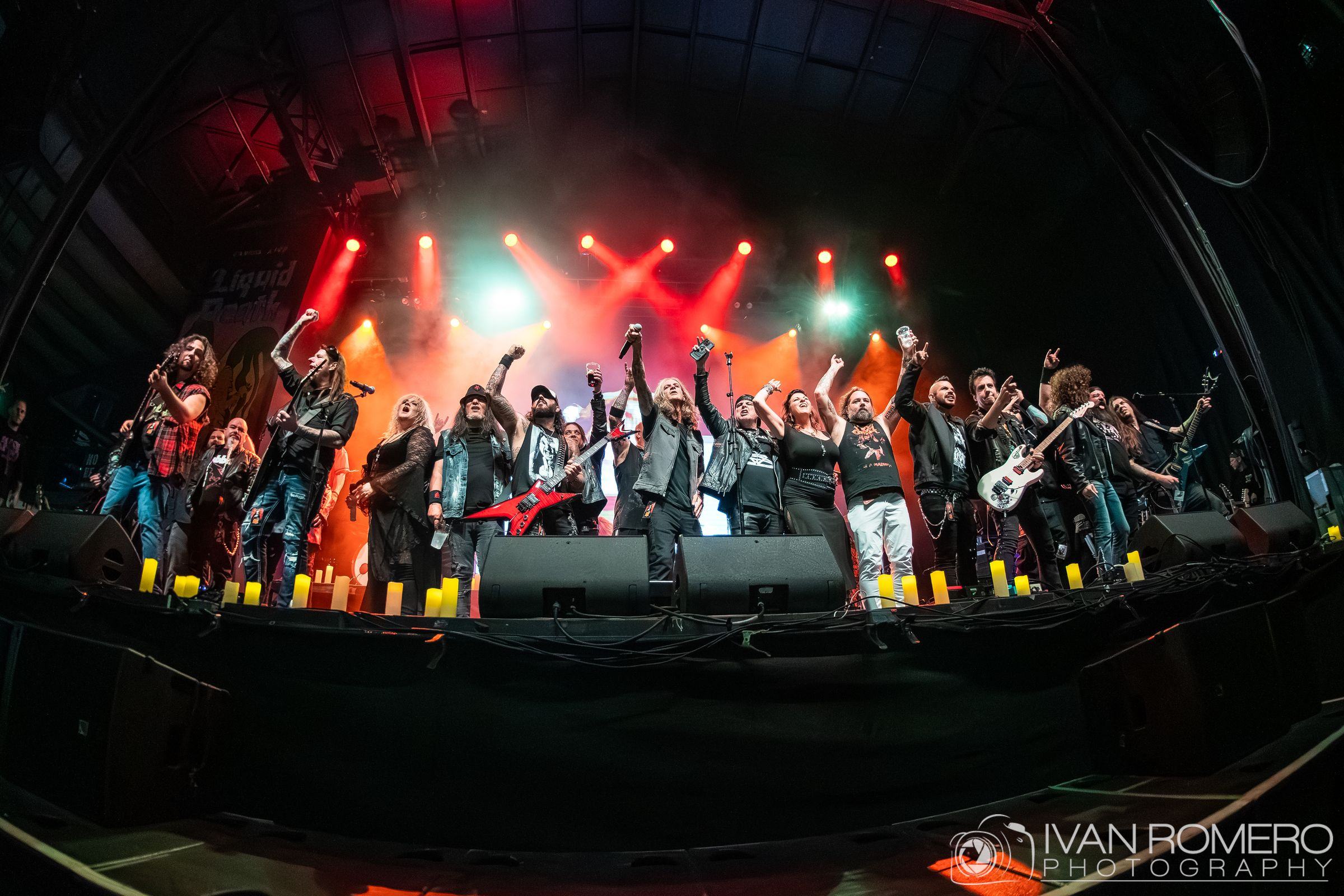 The full cast of musicians on stage at Jannus Live behind a row of candles