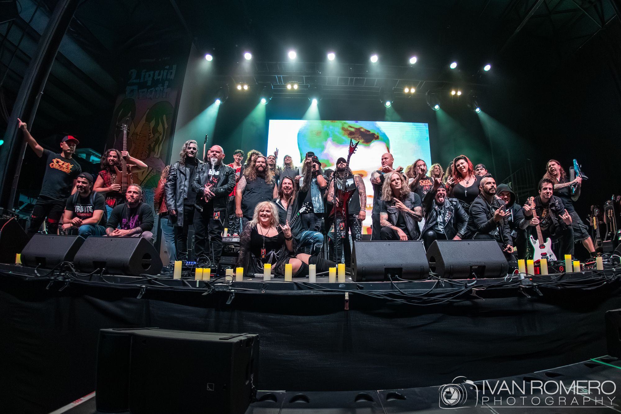 The final group portrait: every performer on stage under white light