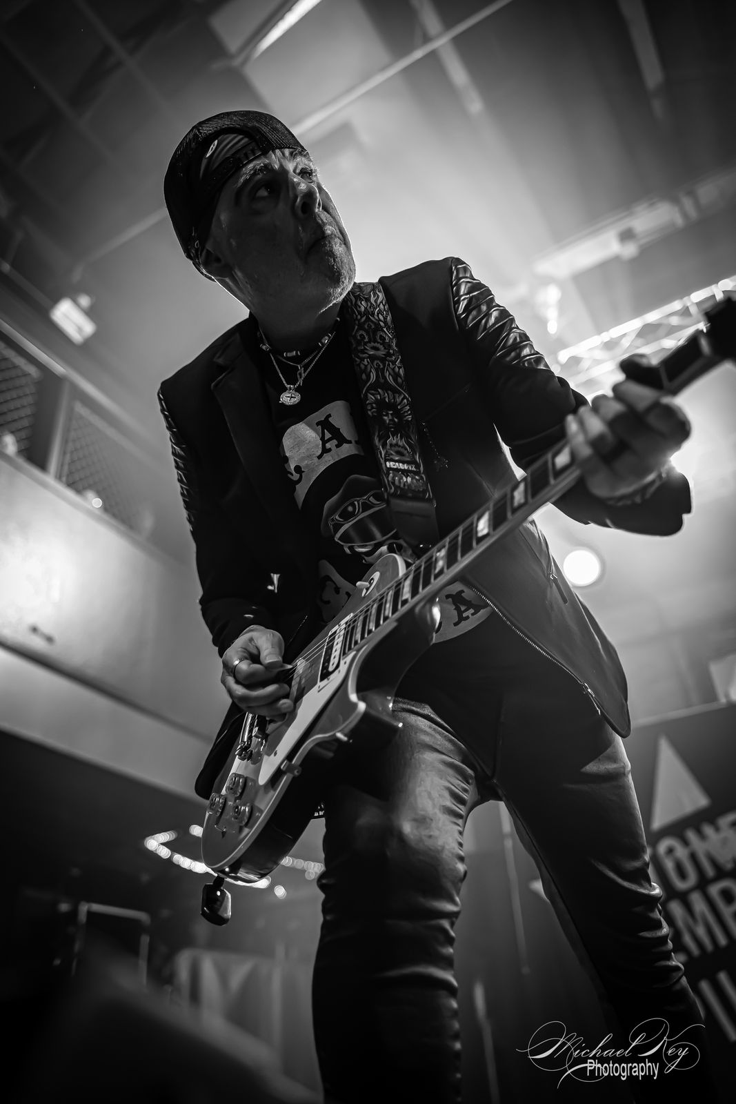 Black-and-white: a guitarist mid-strum